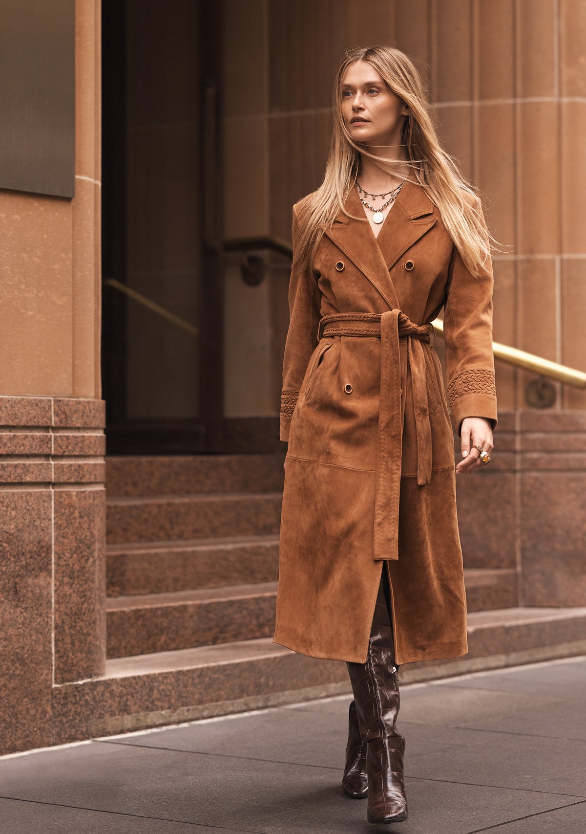 Woman wearing brown suede coat